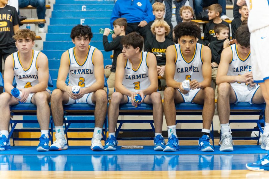 Senior and basketball player Jake Griffin (second from left) gets ready to compete with his teammates in a CHS home game. Griffin said the crowd helps to motivate the team to perform their best. 