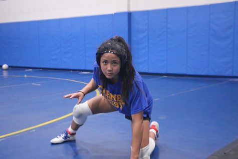 Wrestler and Rugby player Chloe DeLeon practices her ready stance on the new womens wrestling team. She is also a member of the womens rugby team.  
