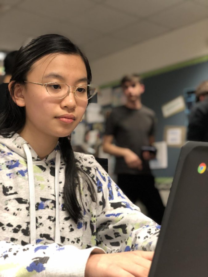 Elizabeth Guo, HOSA member and sophomore, looks at the HOSA website on Feb. 24. Guo said March will be her first time at SLC and that she is nervous for her test, but excited about the new experience.