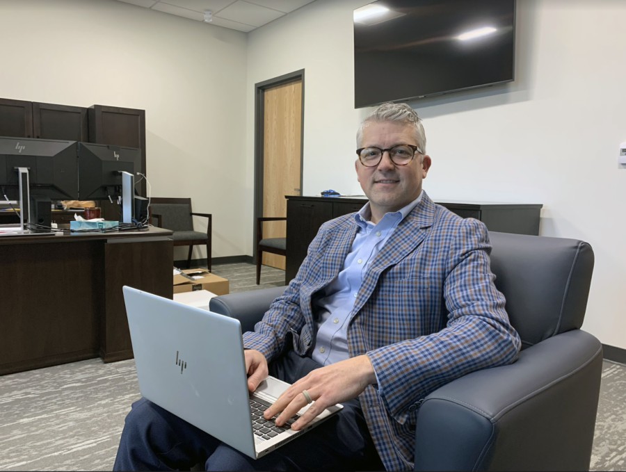 Principal Tim Phares works on his laptop. Phares said school administration is preparing for the new polytechnic department, which will emphasize project-based and experiential learning and provide alternate graduation pathways for students starting in the 2023-24 school year.
