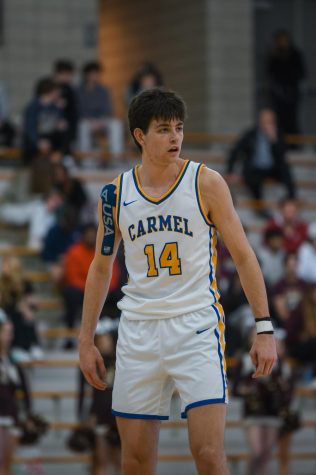 Sam Orme takes a breath during the game against Brebeuf on Feb. 21 at 7:30 p.m. This game was also senior night, and Carmel won 65-43. Photo by Luke Miller.
