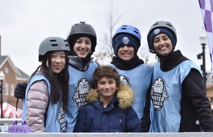 Carmel Mayor’s Youth Council (CMYC) members pose for a photo during the annual Winter Games at the Ice at Carter Green event. According to CMYC President and junior Bhavi Vishnumolakala, the Winter Games include games such as the Ice Trike Relays, Human Curling, and Human Hungry Hungry Hippo. (Submitted Photo: CMYC)