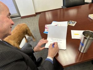 Superintendent Michael Beresford writes messages on birthday cards for Carmel Clay School staff members. Beresford said that it’s important to celebrate and recognize the people that help our school run.