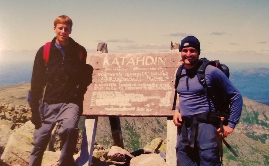 Science teacher Craig Harper (left) on the Appalachian Trail next to the Mt. Katahdin sign in Maine in 2005. He said the best part of hiking is not knowing what would happen the next day.