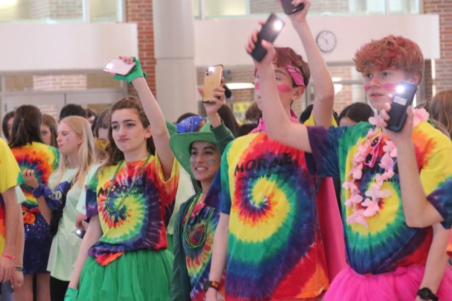 Participants wave their phone flashlights at the CHS Dance Marathon on Feb. 25. The annual event, led and organized by Cabinet members, included color-coordinated groups, dancing, activities and a celebration of the record-breaking fundraiser. (Submitted Photo: Allie Wolf)
