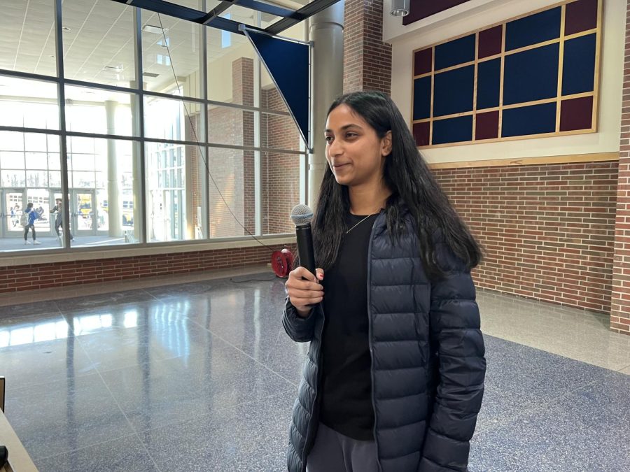Competitions head and senior Amogha Paleru stands on stage during a HOSA meeting on March 2  in the Freshman Cafeteria. The meeting discussed HOSA merchandise and event guidelines.