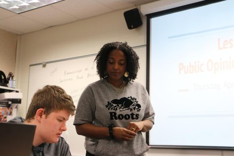 Government teacher Dominique Camara checks in with her students during an activity in class on April 20. Camara said people tend to have the similar political views as their parents.