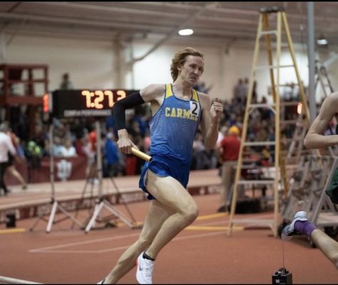 Kole Mathison, track and field runner and senior, runs in the HSR finals at Gladstein Fieldhouse. Coach Altevogt said that the team will be top contender for the State championship in early June.
