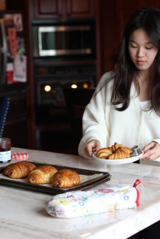 Senior Anabelle Yang holds her finished croissants. She said she enjoys baking French breads and pastries.