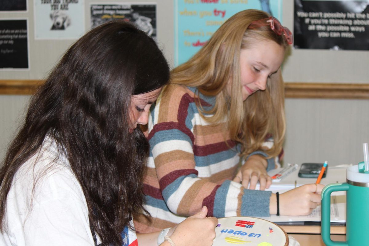 Seniors Aila Mckeown and Odessa Norton complete classwork during a National Honors Society (NHS) tutoring session on Sept. 19. Members of NHS tutored students from CHS in different subjects in order to gain volunteer hours and provide help towards the community. 
