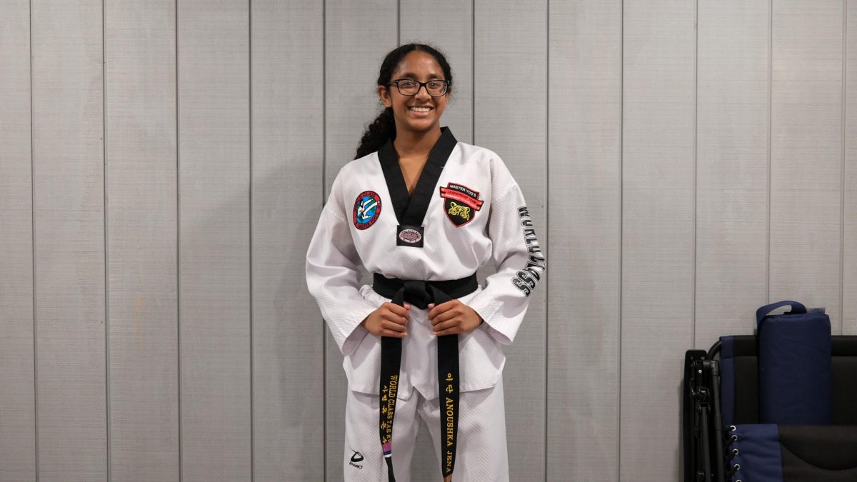 Sophomore Anoushka Jena poses in her dobok for Taekwondo. Doboks are worn traditionally in Korean martial arts.