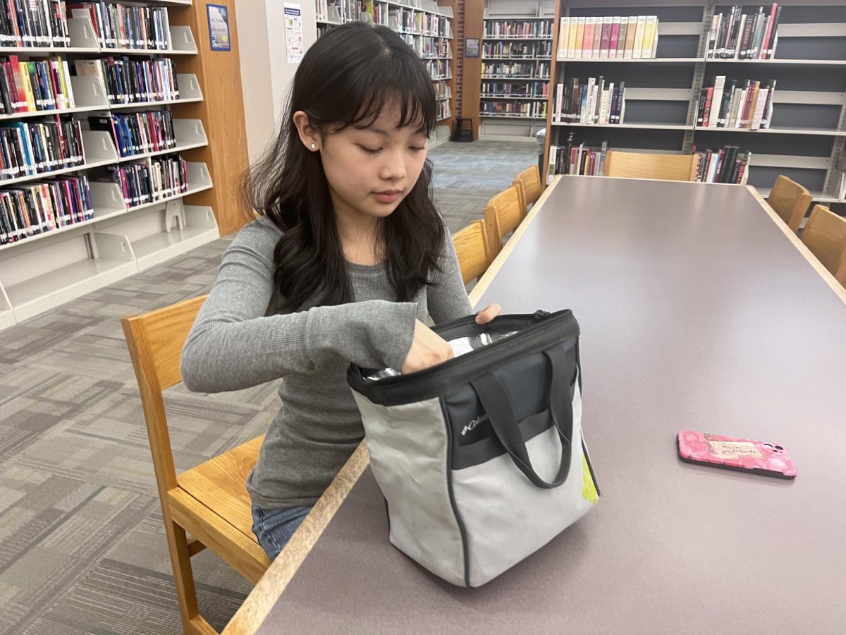 Sophomore Ivy Wei takes unpacks her lunch on Sept. 19th, 2023. I usually bring my own lunch to school because its more convenient, said Wei.