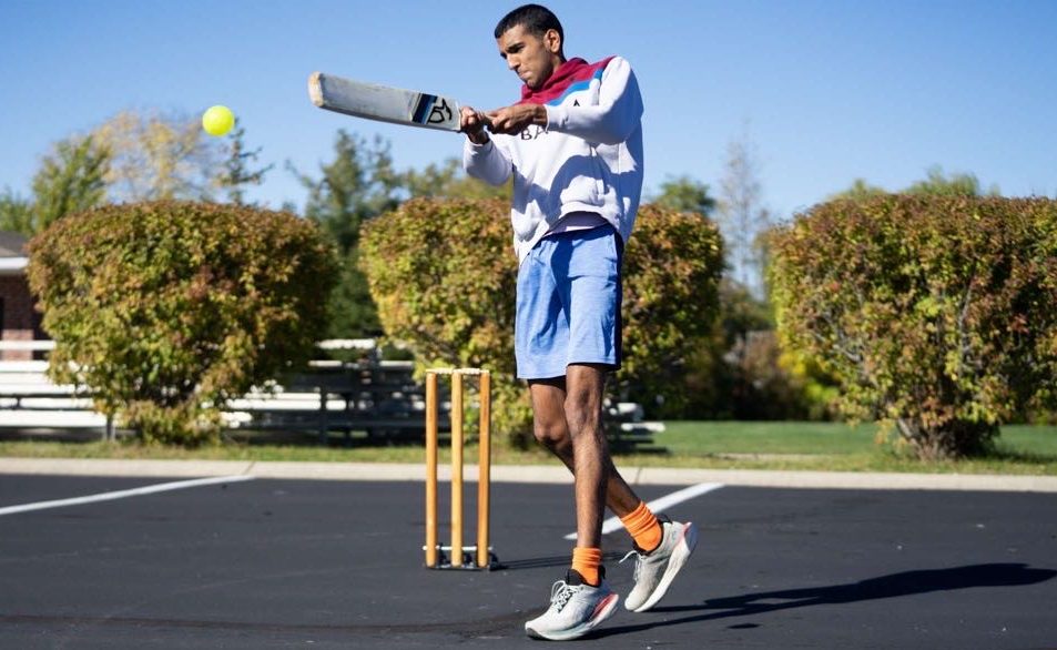 Aayush Singh, Junior plays cricket in a parking lot on Oct 22. 2023. Singh said he believes Cricket is becoming a more popular sport every day.