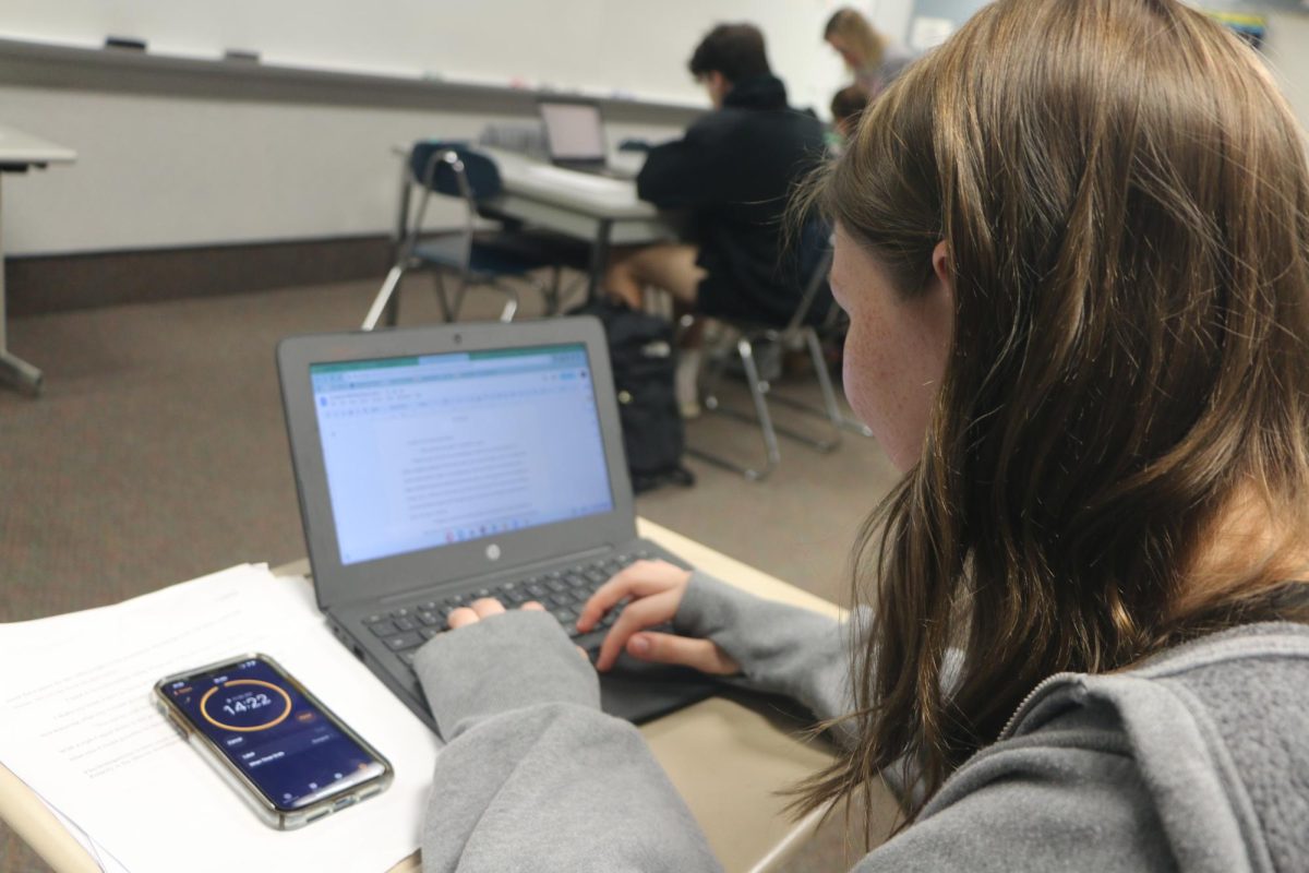 Senior Claire Fackler completes schoolwork during class. I often use a timer on my phone to make sure I stay focus, said Fackler. 