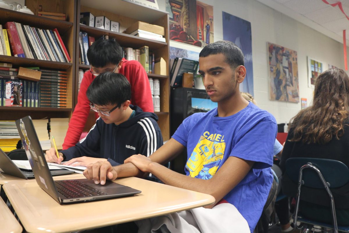 Junior Aayush Singh completes problems on Khan Academy for the digital PSAT. Singh said the format changes could improve student performance but will not affect his perception of the difficulty or testing environment of the PSAT. 
