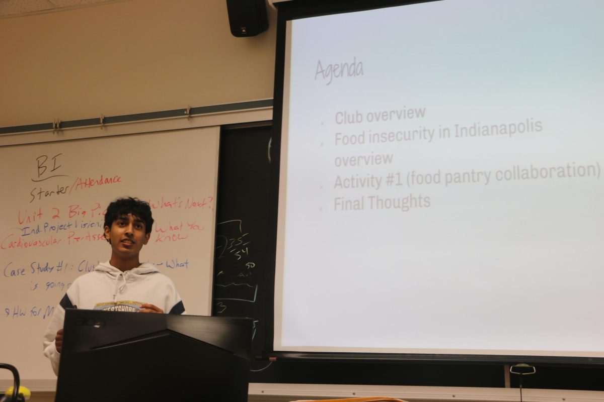 Hrithik Arcot, Food for All co-leader and senior, leads a club meeting. Arcot and 