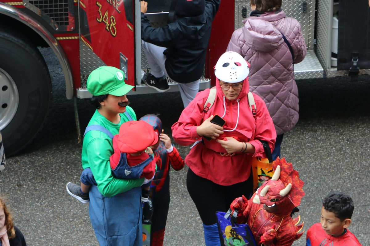A family dresses up as their favorite characters at The Arts in Autumn Event on Oct. 14. The event took place at Midtown and was a great way for families to enjoy the spirit of Halloween during the day.