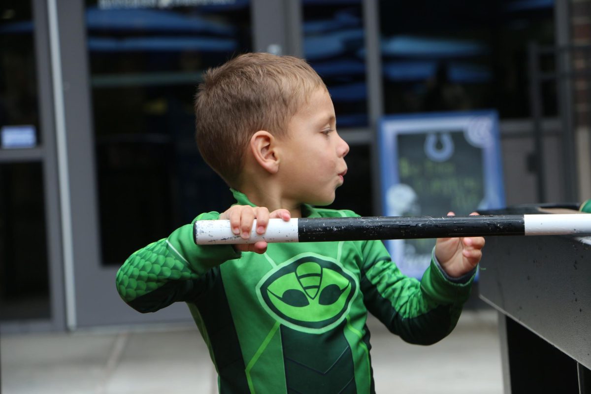 A child plays pool in their PJ Masks costume at The Arts in Autumn event at Midtown on Oct. 14. The event was a place where kids got to play all kinds of games as their favorite superheroes/characters and enjoy the sweet treats available. 