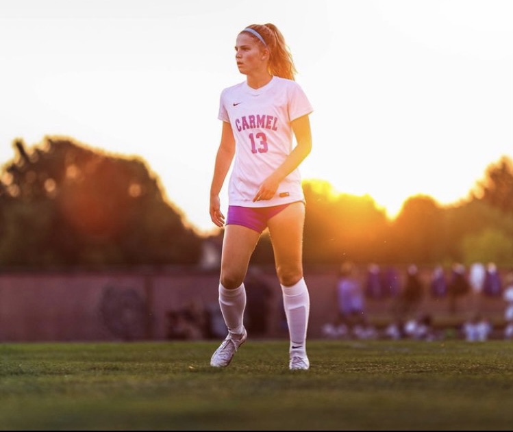 Lucy Floyd, center back and senior, walks onto the field during the game against Brownsburg on Aug. 10. Floyd said the members of the team have improved since their preseason match.
