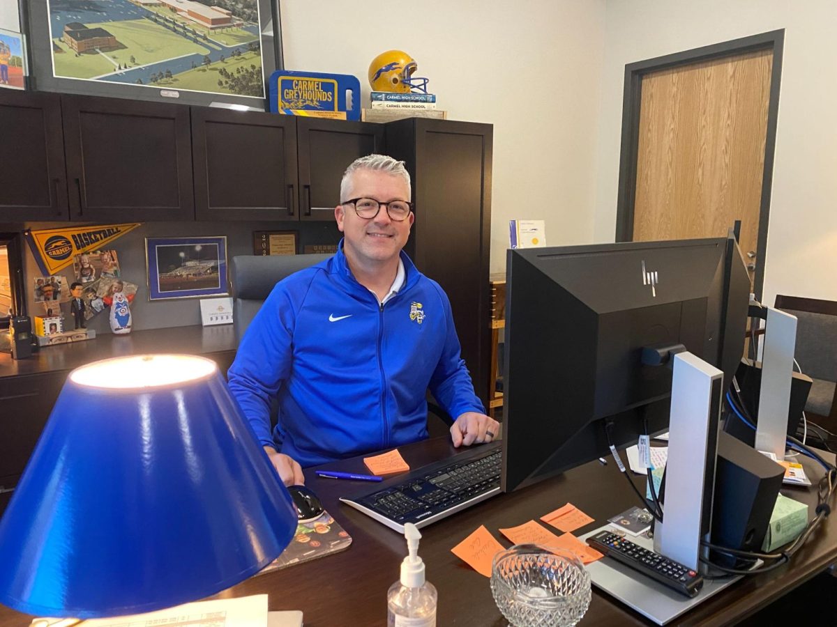 Principal Tim Phares works behind his desk. The school’s administration is currently preparing for the 2024-2025 school year. Phares said it was “hard to comprehend that we’re already talking about a new school year.” 