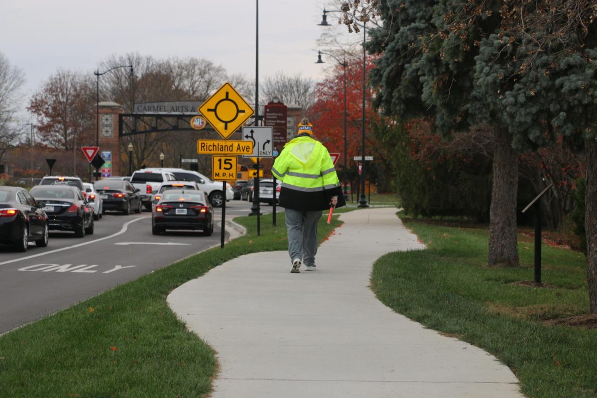 Math teacher Mellissa Stringham leaves the crosswalk after directing traffic on Nov. 15. Laura Erli, Civil Engineering and Architecture teacher, said, I thought that they [RRFB] were a great idea.