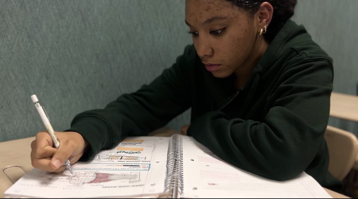 Junior Ariyanna O’Neal drawing for her Human Body System notes. “I love how Carmel is able to offer classes that can get you a headstart on your career path,” ONeal said.
