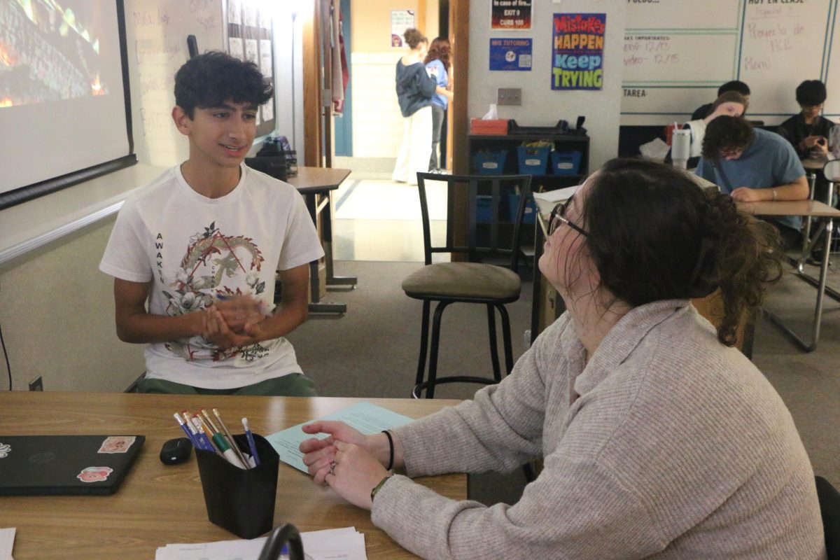 Sophomore Arjun Yadav (left) and Spanish teacher Margaret Edwards (right) have a conversation about their plans over winter break in Spanish on Dec. 12. Yadav said, “Students could take more foreign language classes, utilize language learning apps, go to some of the clubs that CHS offers, or even watch shows from other countries that are linguistically different than here.”