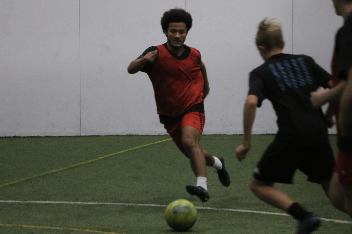 Junior Chris Gabriel practices for his Hoosier FC boy’s team before an Indy indoor Off The Wall soccer game. “Practice can be really rough, but the effort I see in my team regardless of winning or losing is incredibly motivating,” said Gabriel. 