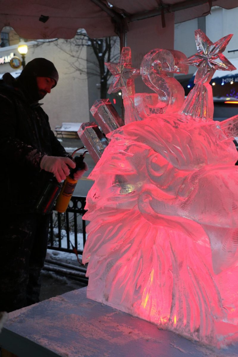 Elegant Ice Creations workers sculpt an American bald eagle on Jan. 19 at the Arts & Design District. From 4 to 8 p.m., the artists worked on and showcased their ice carvings.