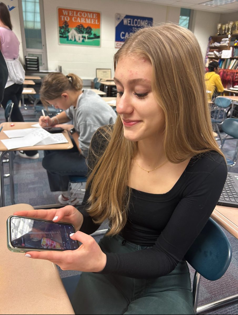 Junior Sophie Parker scrolls through social media and different brand-sponsored posts on January 12, 2024. The number of brand deals and sponsorships of influencers and celebrities continues to increase. 