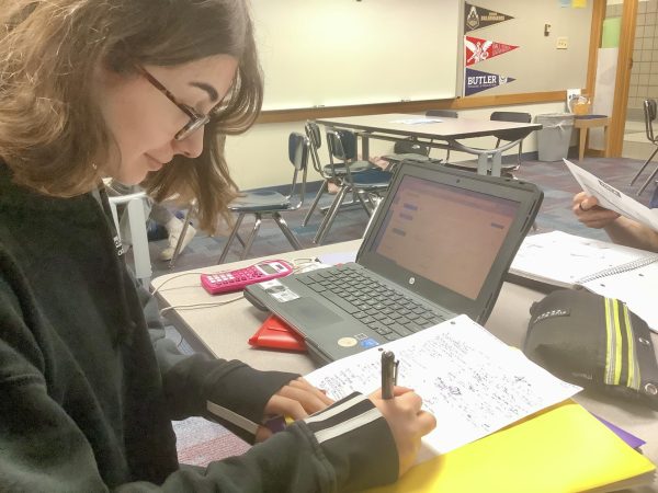 Victoria Pavlakos, FCCLA vice president of programs and junior, completes her homework during SRT on Jan. 25. “To prepare for the State Conference, reviewing the rubrics is the most important thing we’re doing,” Pavlakos said.