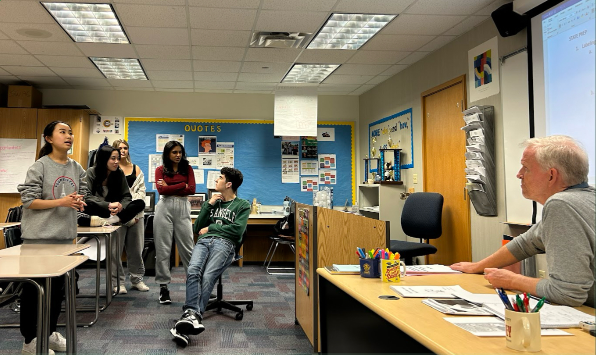 Mock Trial members practice in room F102 for upcoming State finals. The meeting on Feb. 26 reviewed the court case with Mr. Browning. Rebecca Lee, Mock Trial President and senior, (left) said that the teams are preparing a lot for the trial.