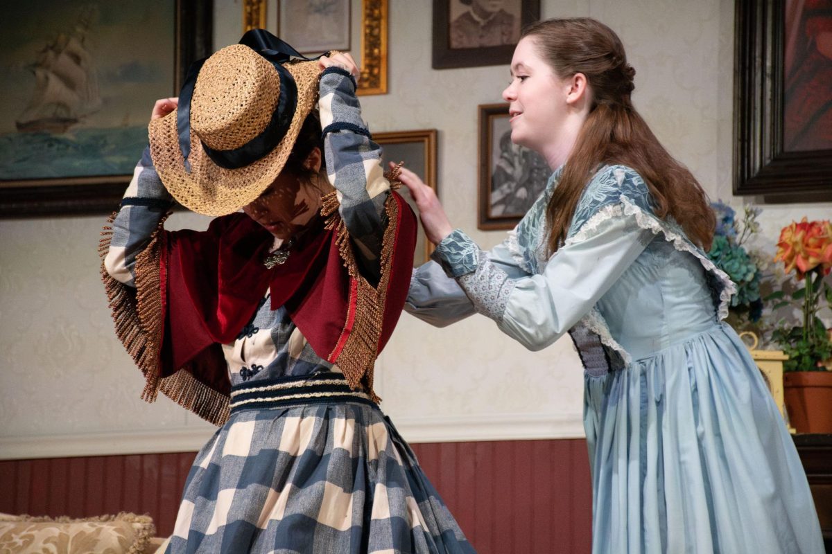 Senior Juliet Malherbe (left) and sophomore Emma Miller play Jo and Beth March in Little Women on Jan. 31. The other Beth sisters were played by seniors Sophia Malerbi (Amy) and Anna Wagner (Meg).