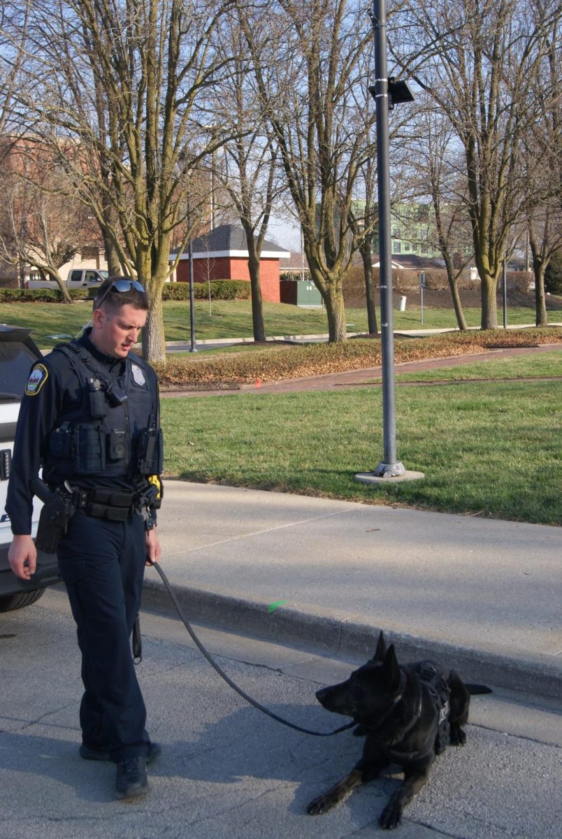 Carmel Officer Owen and K-9 unit Jax play ball outside the Carmel Police Department on March 13. Jax is three years old and has been training with Officer Owen since he was one and a half years old. Jax is an apprehend and narcotics K9 and has been working with Officer Owen for almost two years.