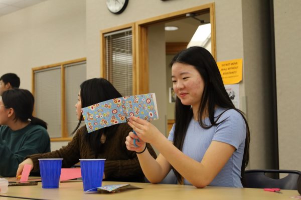 A5 member Lucy Han makes a lantern at the Lunar New Year meeting on Feb. 16. Haider said the upcoming meeting is centered around Ramadan and Women’s National History Day. 