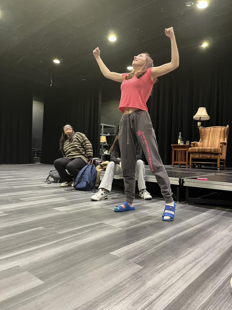 Allison Miller, senior and ComedySportz Member, demonstrates a game in the Studio Theater on Monday, March 18. In preparation for their away match on March 20, Miller and the other members of ComedySportz practice various gimmick games.