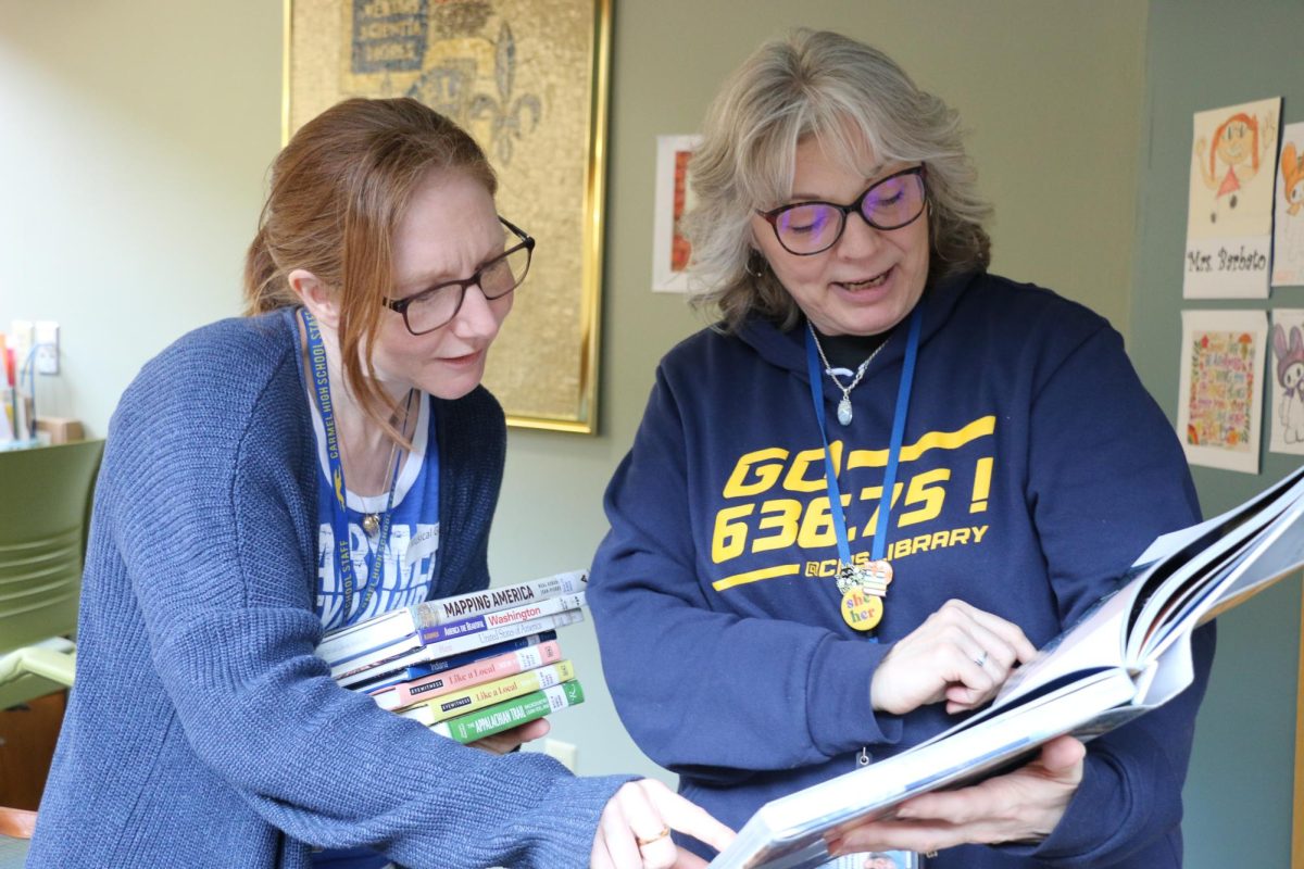 Media Specialists Hannah Barbato (left) and Teri Ramos (right) shelve books together on Mar. 1, 2024 at the CHS media center. “I really enjoy putting apart some of my time to shelve books and help students,” Ramos said.
