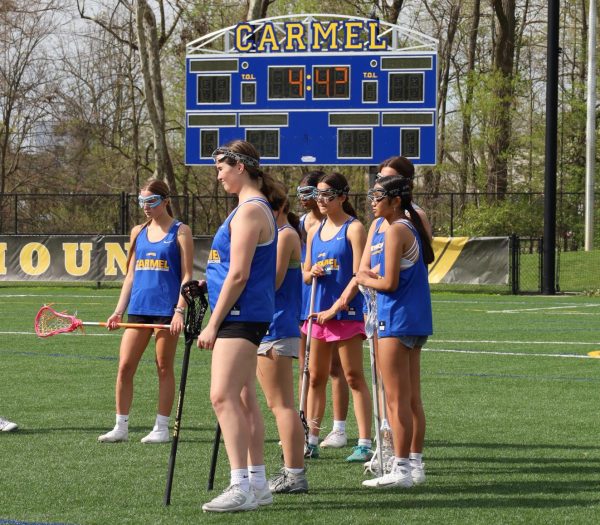 The women’s lacrosse team practices on the Carmel field on April 18. Junior Chloe Putnam said she feels the team has done well this season, as they have gone undefeated in in-state games this season. 