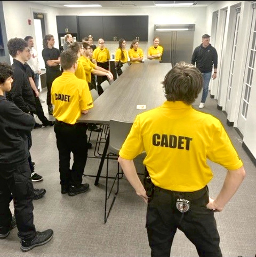 John+Fike%2C+Master+Patrol+Officer%2C+SRO+and+Carmel+Cadet+adviser%2C+discusses+field+sobriety+tests+and+how+to+conduct+them+with+the+Carmel+Cadets.+Fike+said+teaching+students+about+important+police+duties+like+field+sobriety+tests+would+enable+them+to+be+educated+and+responsible+members+of+their+community.+