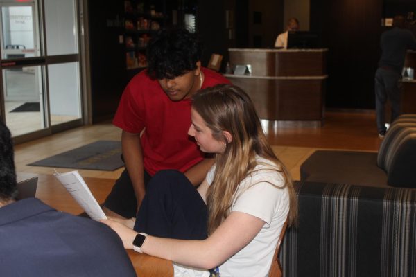 Seniors Jillian Rang and Athul Ramkumar practice their presentation at the DECA state competition on March 5, 2024. Arya Patel, DECA paper head and junior, said, As they [students] begin to make their final preparations, its important to remember that making it to this point is an incredible achievement.