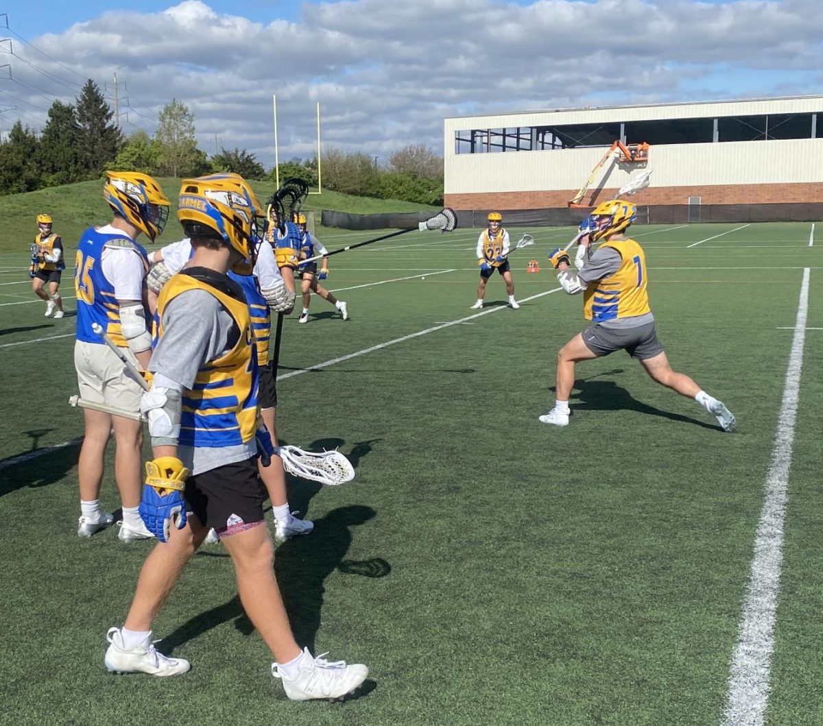 Members of the Lacrosse team play in a scrimmage on April 24. Head Coach Keith Allen said offensive players have been using scrimmages to practice their plays and sets.