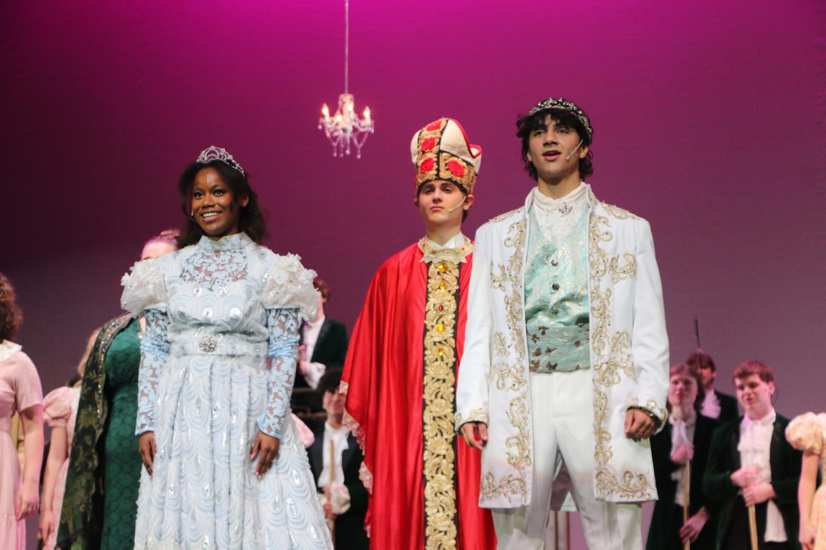 Junior Isaiah Henderson as Prince Topher and senior Gabi Bradley as Cinderella get married on stage on May 10. The show was Rodgers and Hammersteins adaptation of the classic story and ran from May 9 to 11. 