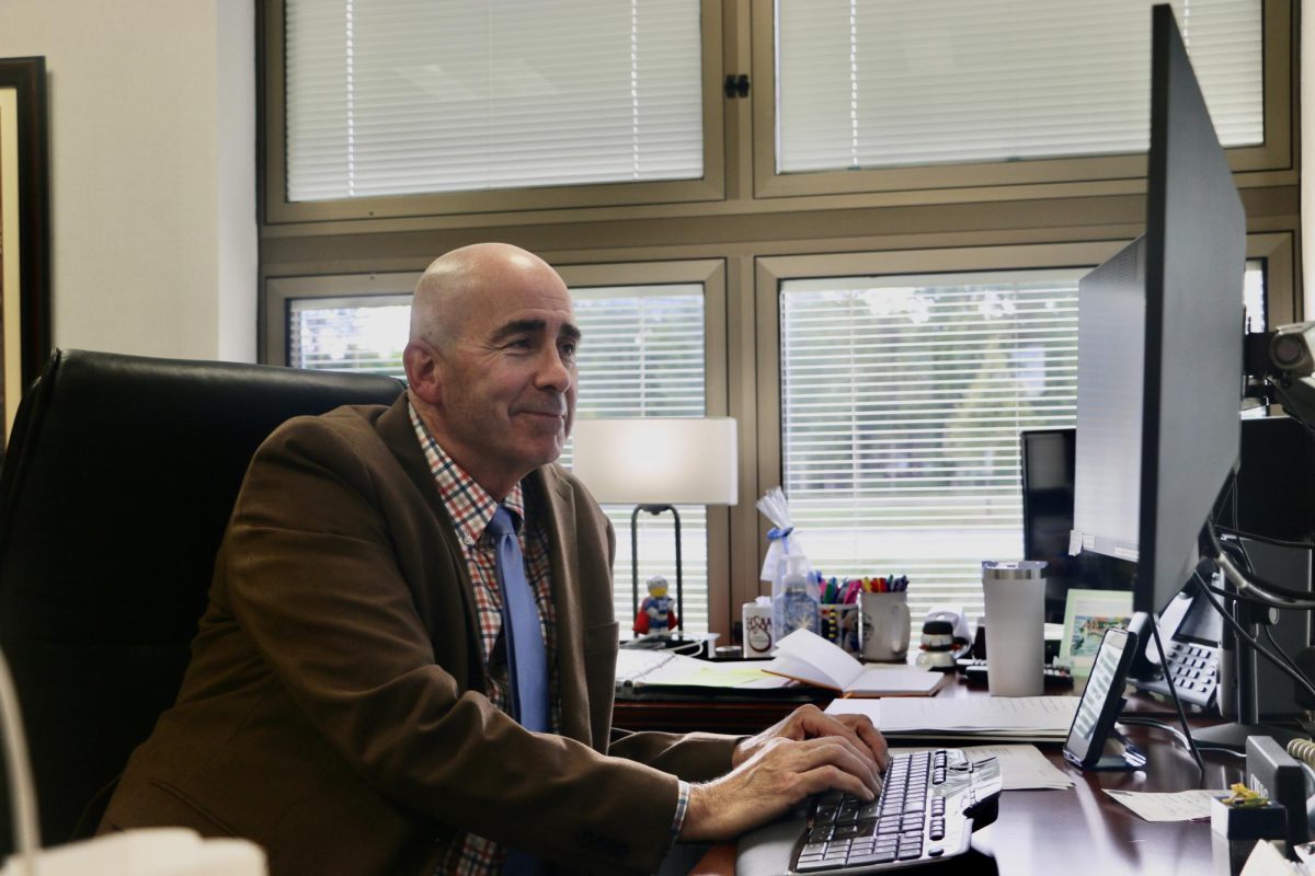 Superintendent Michael Beresford looks at the district’s website for information about transportation. Beresford said the whole district has taken time to ensure everything is coordinated.