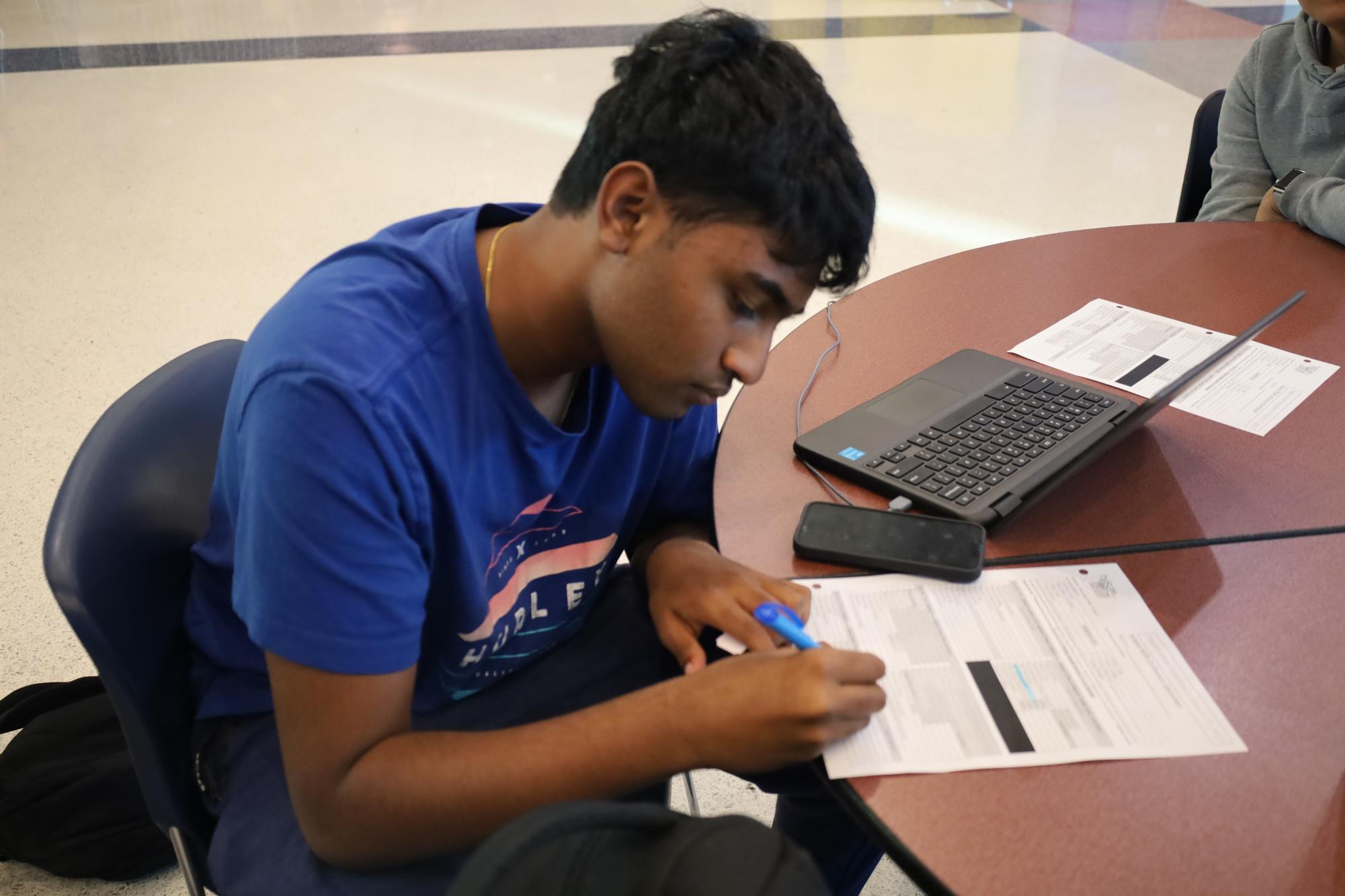 Sophomore Ronith Nadella attends a mandatory HOSA meeting after school on Nov. 11 to learn more about the selection of competition events. Students left the meeting with new mindsets and a better understanding of what they will compete in the State Leadership Conference (SLC).