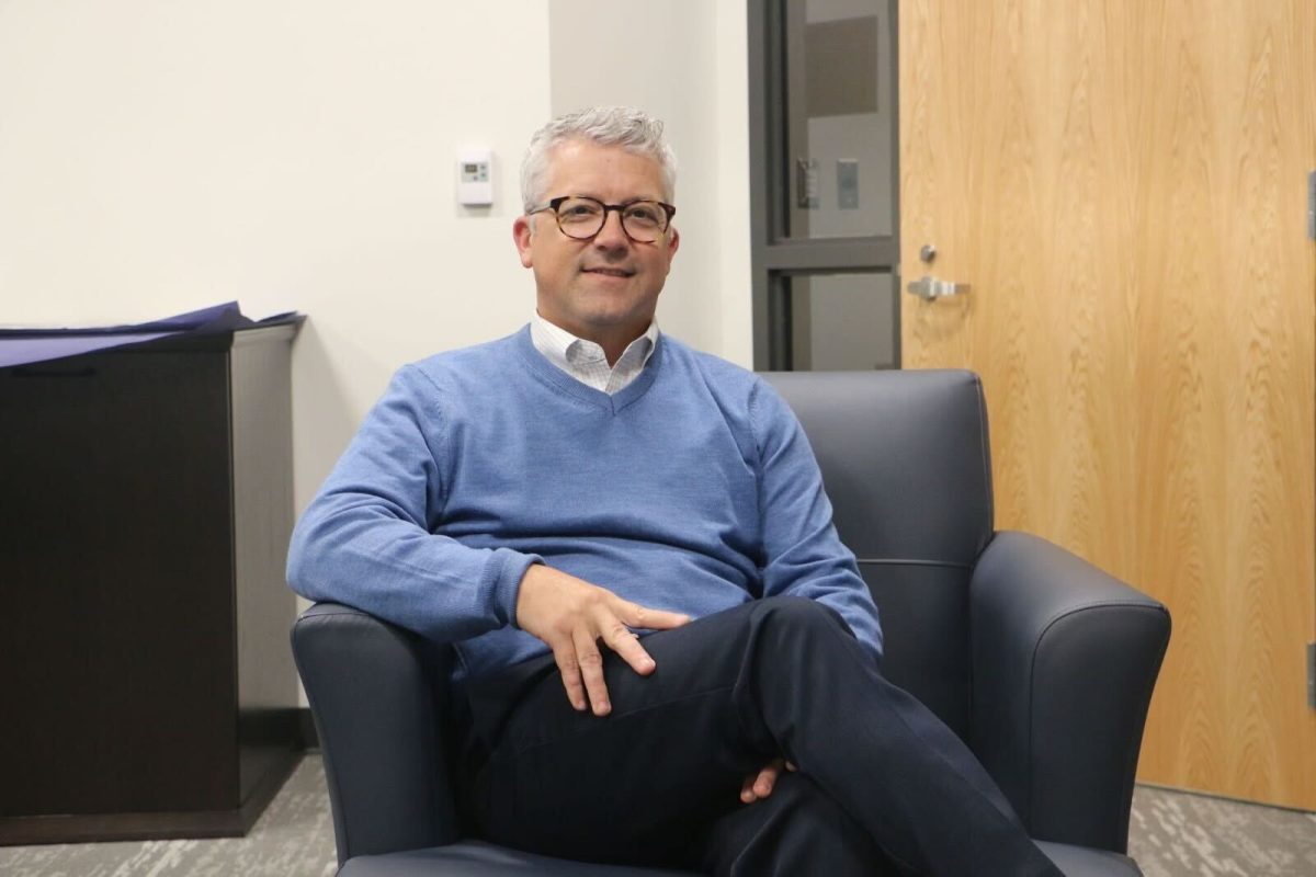 Principal Tim Phares sits in a chair in his office. "I feel, and this is my perspective, we are pretty receptive and constantly reflecting to make changes on how we look at things," Phares said. (Submitted photo: Grace Guo)