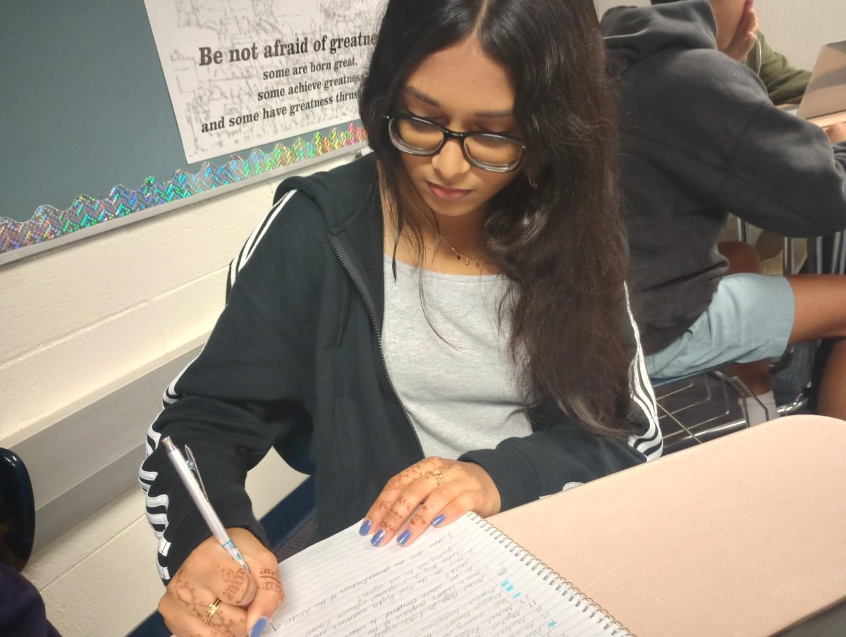 Sophomore Divya Rajendran works on her chemistry notes. “Every single assignment or worksheet is more or less done on paper,” she said about her science class. “But I feel like it's more simple when it's done on paper.”
