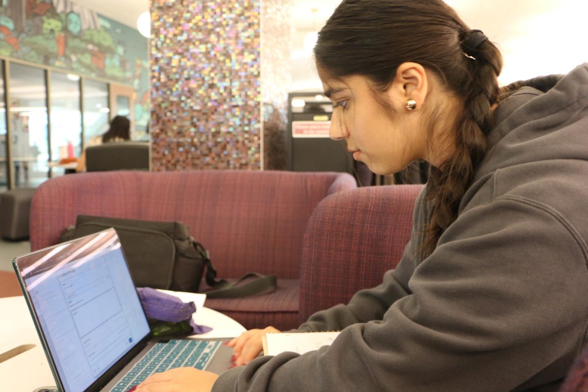 Sophomore Vedika Vyas completes homework for AP precalculus BC after school at the library on Sept. 13. She said, “(I) wouldn’t say that there is more work for AP precalculus than honors 
Algebra II. Obviously they are different courses, but I would say (AP precalculus BC) makes (us) think deeply about foundations established in honors Algebra II.”