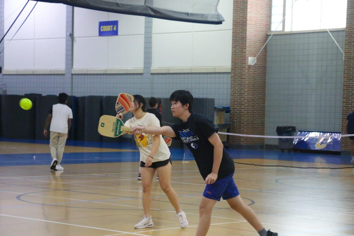  Sophomore Edward Chen hits a pickleball at the Pickle-Pong Club callout on Aug. 23 in the Fieldhouse gym. The club consisted of playing pickleball and ping pong games.