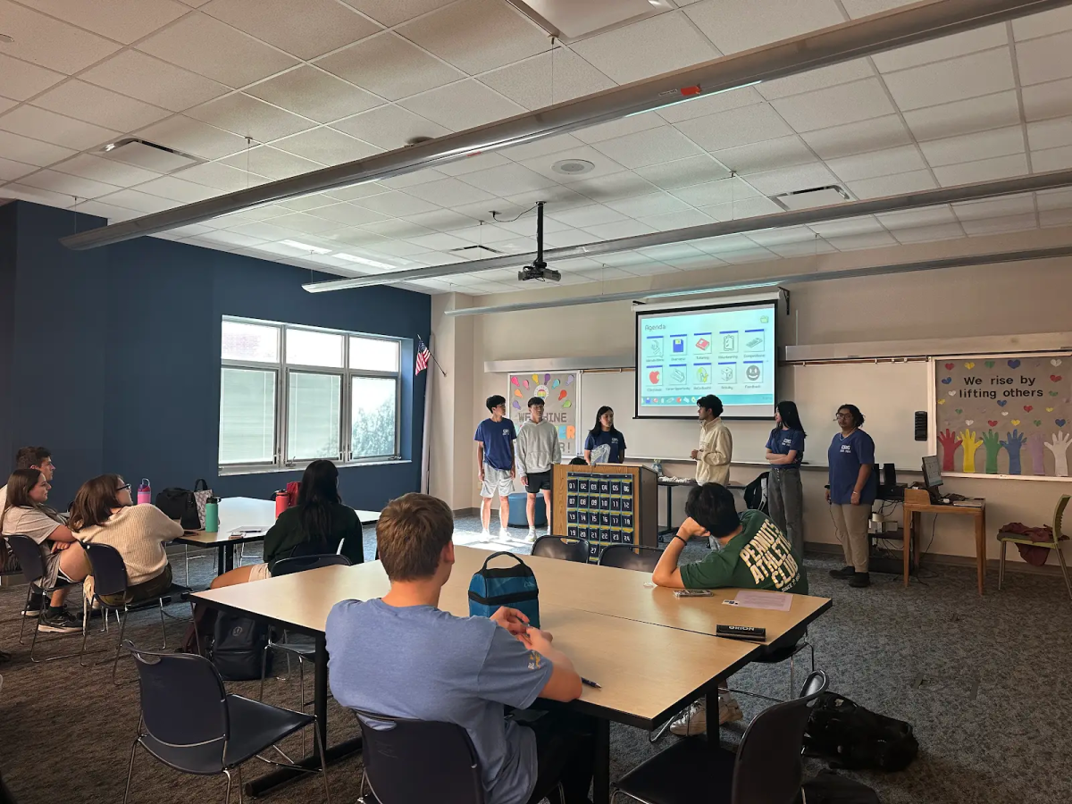 CSHS officers present the meeting agenda to members during the CSHS meeting on Sept. 9. Maanav Rajesh, CSHS president and senior, said, “We are planning on going to elementary schools and middle schools and teaching people and teaching kids basic computer science things such as staying safe online and cyberbullying.”