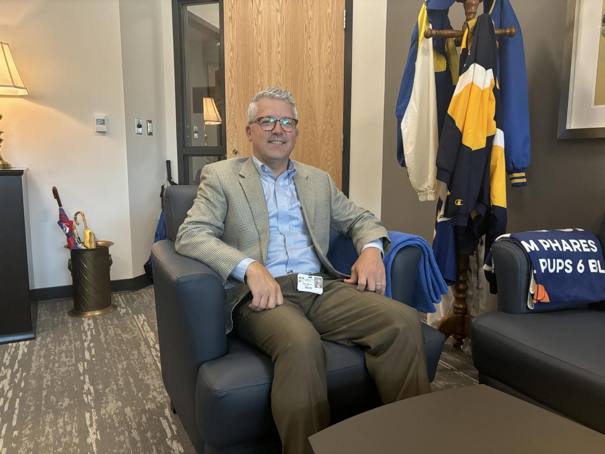 Principal Tim Phares sits in the Administration Office. Phares said administration is going to navigate the new diploma requirements to make sure students are prepared.